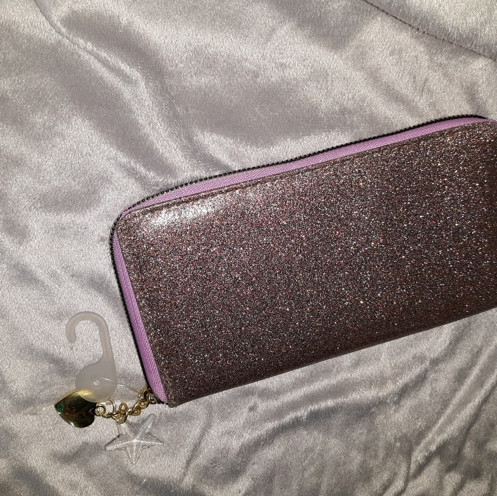 Sparkly pink wallet with heart and star charms